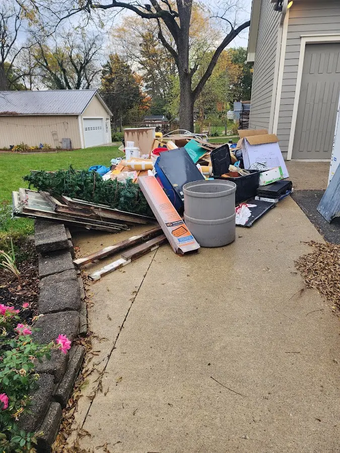 Dumpster being loaded with debris for 30 Yard Dumpster Rental in New Bremen